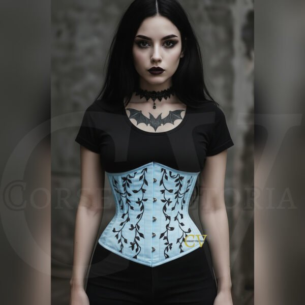 Woman in gothic style wearing a light blue corset with black vine embroidery, paired with dark makeup and bat tattoo, Halloween fashion.